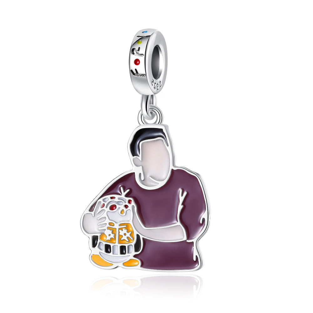 Man Holding a Puppy Charm